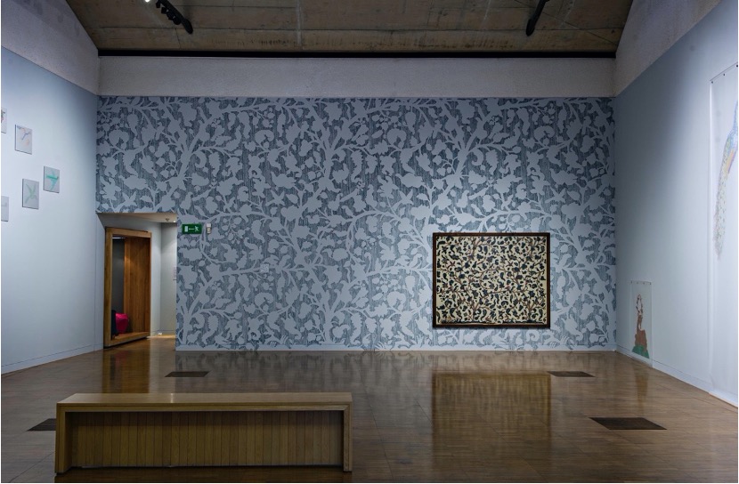 Figure 1. Installation image of the “Stitch & Peacock” exhibition in The Collection Museum, 2014-2015. Shown here: “Flock” (fragment on the left side wall), “Nest” 10m x 5m (centre), “Happy Hunting Ground: Stag and Cock” (right side wall). Photo credit: Andrew Weekes.